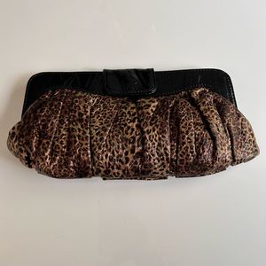 Leopard clutch with removeable longer strap and snap closure
